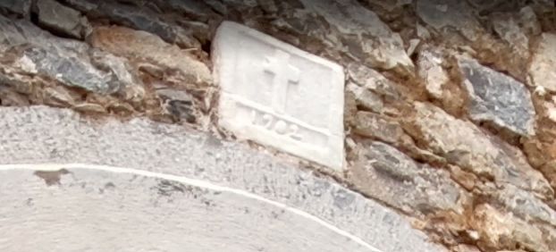 Historic 1902 date stone connected with the origin of the restored stone houses in Mavrikiano