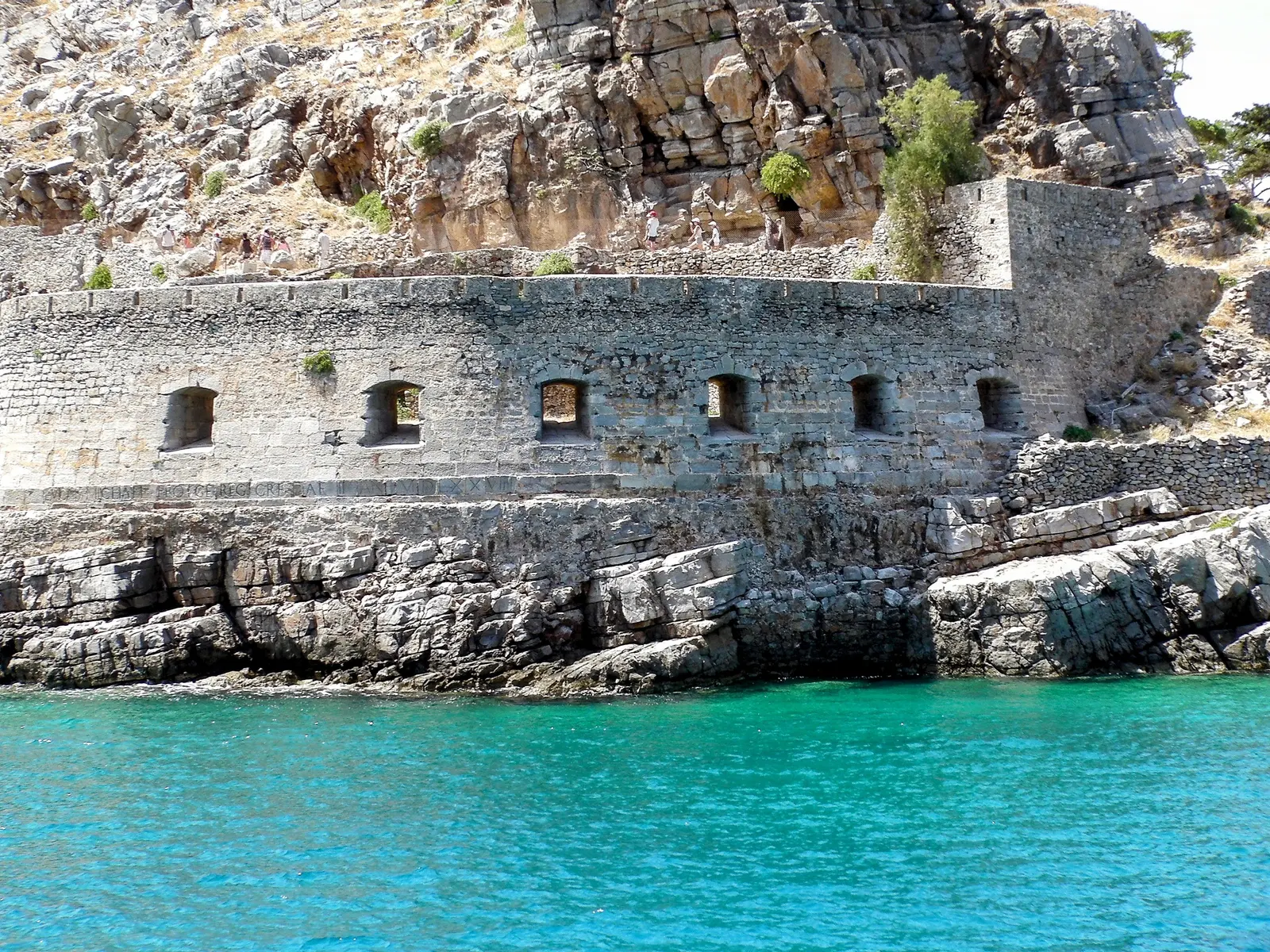 Venetian coastal fortifications along the rocky shoreline of Spinalonga.